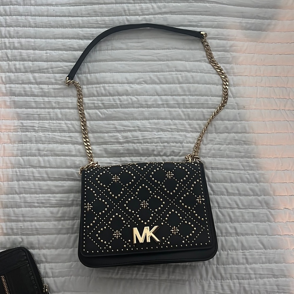 Michael Kors Black Purse for sale. Comes with wallet. Slightly used.